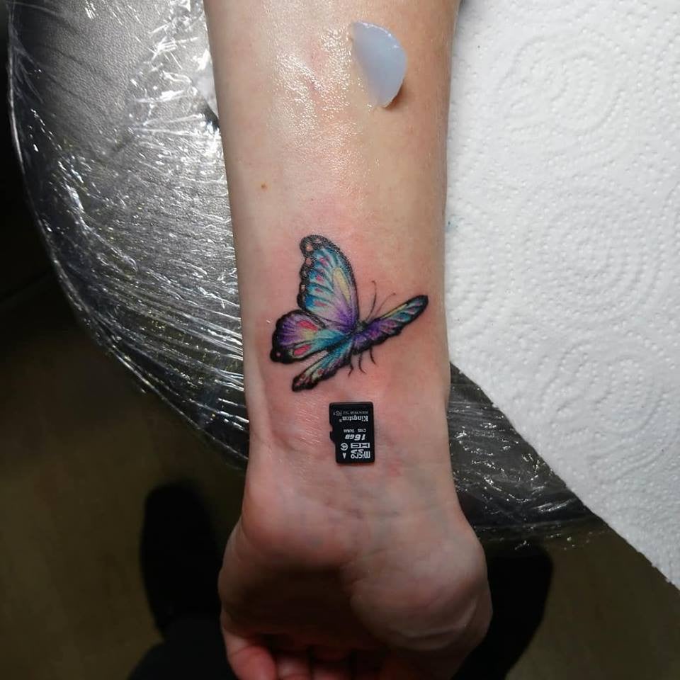 На запястье бабочка, фото -  Stigmata tattoo