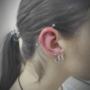 Пірсинг індастріал (з титановою прикрасою для первісного проколу)