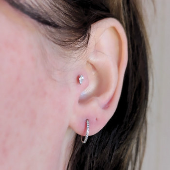 Прокол трагус