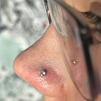 Прокол крила носа