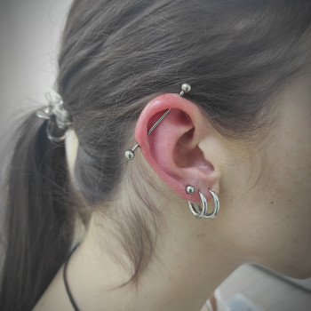 Пірсинг індастріал (з титановою прикрасою для первісного проколу)